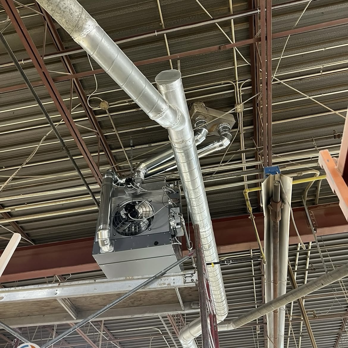 Commercial ductwork and suspended heating equipment installation