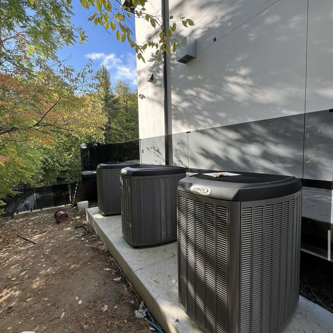 Outdoor air conditioning units installed beside a residential building